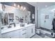 Modern bathroom with double vanity and white tile shower at 724 Last Dance Pl, Henderson, NV 89011