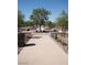 Pathway through a community with trees and seating areas at 724 Last Dance Pl, Henderson, NV 89011