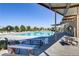 Resort-style pool with lounge chairs and covered seating areas at 724 Last Dance Pl, Henderson, NV 89011