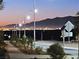 Night view of community with mountain backdrop at 724 Last Dance Pl, Henderson, NV 89011