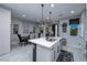 Open concept dining area with modern light fixtures and seating for six at 724 Last Dance Pl, Henderson, NV 89011