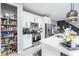 Well-stocked pantry and white kitchen with stainless steel appliances at 724 Last Dance Pl, Henderson, NV 89011