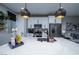 Large kitchen island with seating and modern pendant lighting at 724 Last Dance Pl, Henderson, NV 89011