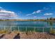 Serene lake with walking path and fence at 724 Last Dance Pl, Henderson, NV 89011