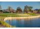 Scenic lakefront view with grassy area and playground at 724 Last Dance Pl, Henderson, NV 89011