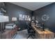 Home office with large desk and dark-colored walls at 724 Last Dance Pl, Henderson, NV 89011