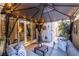 Covered patio with comfortable seating and string lights at 724 Last Dance Pl, Henderson, NV 89011