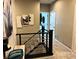 Upstairs hall with modern art and metal railing at 724 Last Dance Pl, Henderson, NV 89011