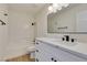 Modern bathroom with white vanity, quartz countertop, and black fixtures at 7305 Backstretch Ave, Las Vegas, NV 89130