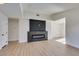 Modern fireplace with dark stone surround in living room at 7305 Backstretch Ave, Las Vegas, NV 89130