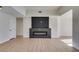 Modern fireplace with dark stone surround in living room at 7305 Backstretch Ave, Las Vegas, NV 89130