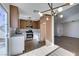 Remodeled kitchen with white cabinets, quartz countertops, and stainless steel appliances at 7305 Backstretch Ave, Las Vegas, NV 89130