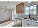 Bright kitchen with white cabinets, quartz countertops and stainless steel appliances at 7305 Backstretch Ave, Las Vegas, NV 89130