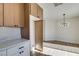 Newly remodeled kitchen with wood cabinets and white countertops at 7305 Backstretch Ave, Las Vegas, NV 89130