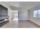 Modern living room with fireplace and wood-look floors at 7305 Backstretch Ave, Las Vegas, NV 89130