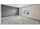 Bedroom with gray accent wall and ceiling fan at 7479 Lassen Peak Cir, Las Vegas, NV 89149