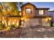 Two-story house with three-car garage at night at 7479 Lassen Peak Cir, Las Vegas, NV 89149