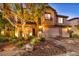 Stunning home exterior at night with landscaping at 7479 Lassen Peak Cir, Las Vegas, NV 89149