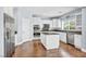 Modern kitchen with white cabinets, island, and stainless steel appliances at 7479 Lassen Peak Cir, Las Vegas, NV 89149