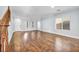 Large living room with hardwood floors and staircase at 7479 Lassen Peak Cir, Las Vegas, NV 89149