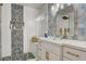 Updated bathroom with glass bowl sink and patterned tile at 7536 Spanish Bay Dr, Las Vegas, NV 89113