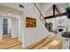 Clean and bright hallway with hardwood flooring and a view of a bathroom at 7536 Spanish Bay Dr, Las Vegas, NV 89113