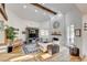 Bright living room with hardwood floors, a stone fireplace, and high ceilings at 7536 Spanish Bay Dr, Las Vegas, NV 89113