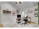 Home office with L-shaped desk and large window at 7536 Spanish Bay Dr, Las Vegas, NV 89113