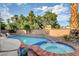 Inviting pool and spa with brick coping at 7536 Spanish Bay Dr, Las Vegas, NV 89113