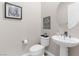 Convenient powder room with pedestal sink at 7576 Windy Meadow Ave, Las Vegas, NV 89178