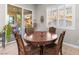 Bright breakfast nook with table and chairs near sliding glass door at 7576 Windy Meadow Ave, Las Vegas, NV 89178