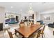 Open dining room with large table and chandelier at 7576 Windy Meadow Ave, Las Vegas, NV 89178