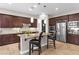 Island kitchen with stainless steel appliances and granite counters at 7576 Windy Meadow Ave, Las Vegas, NV 89178