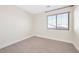 Simple bedroom with wood-look floors and window at 7645 Rustic Galleon St, Las Vegas, NV 89139