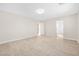 Spacious bedroom with a chandelier and large windows at 7645 Rustic Galleon St, Las Vegas, NV 89139