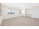 Bedroom with two windows, wood-look flooring, and neutral walls at 7645 Rustic Galleon St, Las Vegas, NV 89139