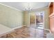 Dining area with hardwood floors and access to the patio at 7645 Rustic Galleon St, Las Vegas, NV 89139