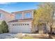 Two-story house with a two-car garage and well-maintained landscaping at 7645 Rustic Galleon St, Las Vegas, NV 89139