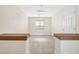 Bright hallway with light neutral walls and flooring at 7645 Rustic Galleon St, Las Vegas, NV 89139