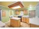 Bright kitchen with an island, gas range, and stainless steel appliances at 7645 Rustic Galleon St, Las Vegas, NV 89139