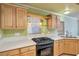 Kitchen with light wood cabinets and gas cooktop at 7645 Rustic Galleon St, Las Vegas, NV 89139