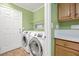 Laundry room with washer, dryer, and ample storage at 7645 Rustic Galleon St, Las Vegas, NV 89139