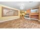 Living room with hardwood floors, fireplace, and kitchen view at 7645 Rustic Galleon St, Las Vegas, NV 89139