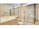 Bathroom with a shower/tub combo and wood vanity at 8236 Horseshoe Bend Ln, Las Vegas, NV 89113