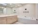 Bathroom with double sinks, bathtub and skylight at 8236 Horseshoe Bend Ln, Las Vegas, NV 89113