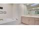 Bathroom with double sinks, bathtub and skylight at 8236 Horseshoe Bend Ln, Las Vegas, NV 89113