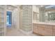 Bathroom with shower, double sinks and glass block feature at 8236 Horseshoe Bend Ln, Las Vegas, NV 89113