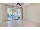 Bright bedroom with tile floors and sliding glass doors leading to a view of the pool at 8236 Horseshoe Bend Ln, Las Vegas, NV 89113