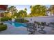 Spacious backyard with a refreshing pool and patio furniture at 8236 Horseshoe Bend Ln, Las Vegas, NV 89113