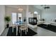 Elegant dining area with chandelier and white table set at 8808 Tom Noon Ave # 101, Las Vegas, NV 89178